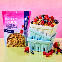 Magic Spoon Protein Granola variety pack with Mixed Berry and Dark Chocolate pouches displayed next to bowls of granola and f