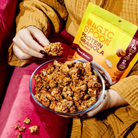 Magic Spoon Protein Granola variety pack with peanut butter flavor shown in bowl and on spoon, yellow package visible.