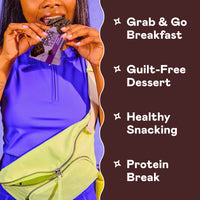 Person holding purple Magic Spoon protein bar wrapper with chocolate bar visible inside.
