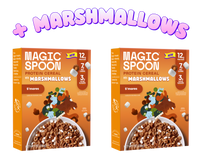 Two orange Magic Spoon S'mores protein cereal boxes with marshmallows and brown cereal pieces visible in bowls on the packagi