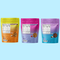 Four resealable granola bags in yellow, pink, and purple gradient colors, each displaying nutrition facts and product informa
